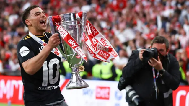 Che Adams with the Championship play-off trophy