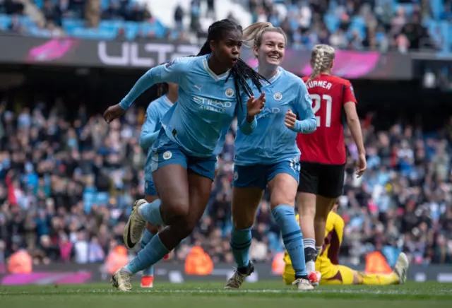 Bunny Shaw celebrates scoring for Man City in the WSL Manchester derby