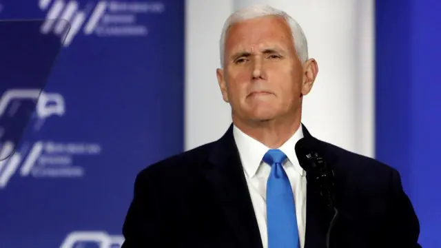 Former U.S. Vice President Mike Pence stands at the podium after announcing he will discontinue his presidential campaign, during the Republican Jewish Coalition Annual Leadership Summit in Las Vegas, Nevada, U.S. October 28, 2023.