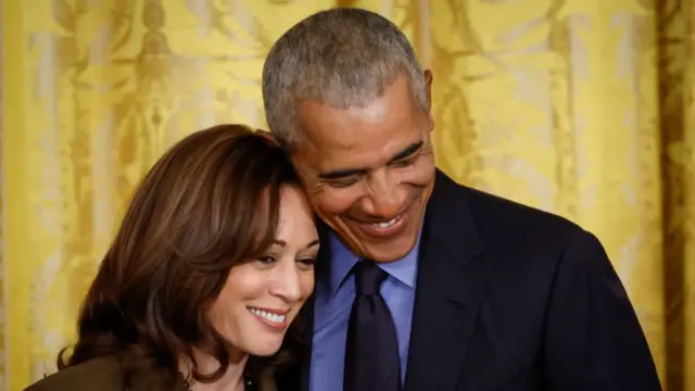 Former president Barack Obama embracing Vice President Kamala Harris