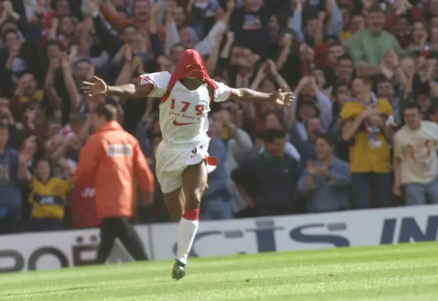 Ian Wright celebrates in 1997 after scoring his 179th goal for Arsenal, breaking the club's scoring record