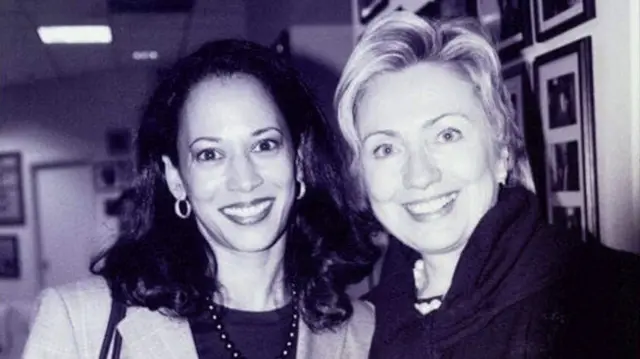 an old photo of Hillary Clinton and Kamala Harris smiling at the camera