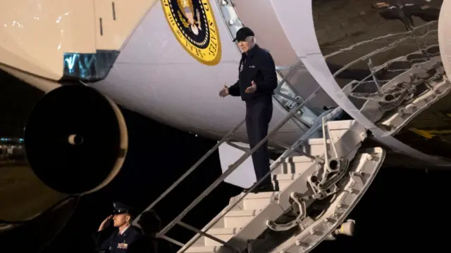 US President Joe Biden gestures as he steps off of Air Force One upon arrival at Dover Air Force Base in Dover, Delaware, on July 17, 2024