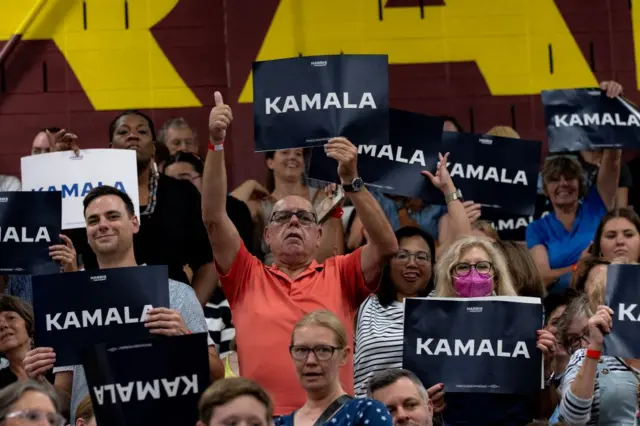 Supporters of Vice President Kamala Harris react to her speaking during a campaign rally at West Allis Central High School