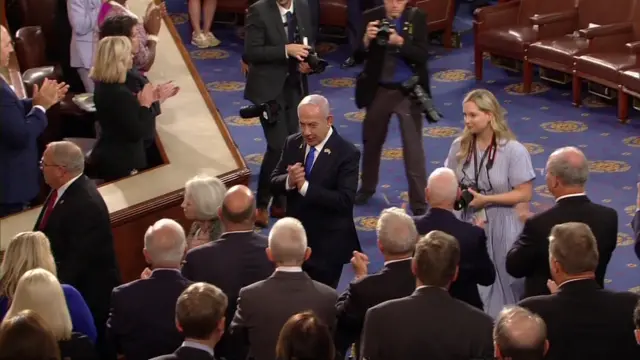 Netanyahu walks through House of Representatives