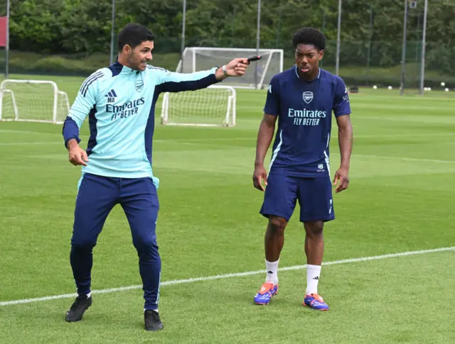 Arsenal boss Mikel Arteta and Myles Lewis-Skelly