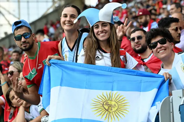 Argentina fans hold up an Argentina flag