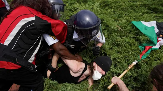 Police arresting protester