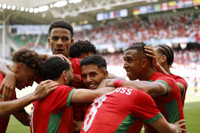 Morocco celebrate scoring against Argentina