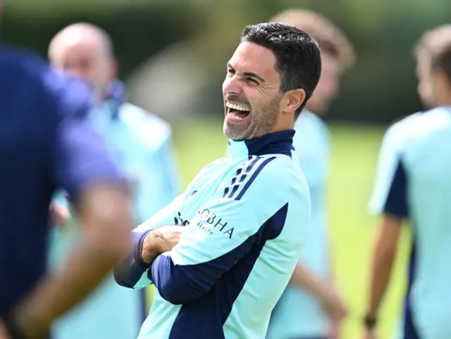 Arsenal boss Mikel Arteta laughing in training