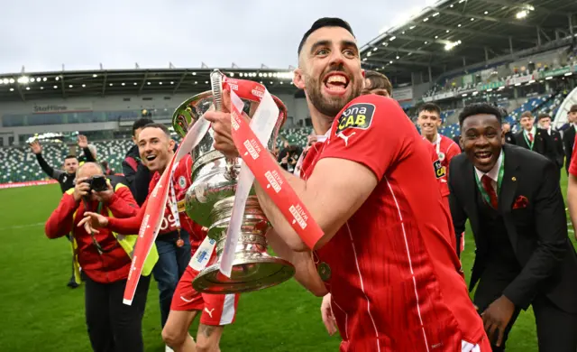 Joe Gormley lifts the Irish Cup