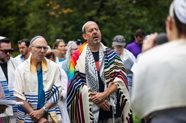 Protesters with the Jewish group 'T'ruah: The Rabbinic Call for Human Rights' pray to end the war in Gaza, outside the US Capitol