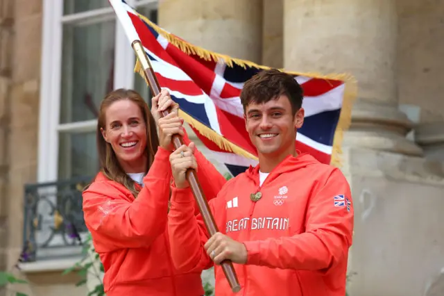 Tom Daley and Helen Glover hold a Union Jack