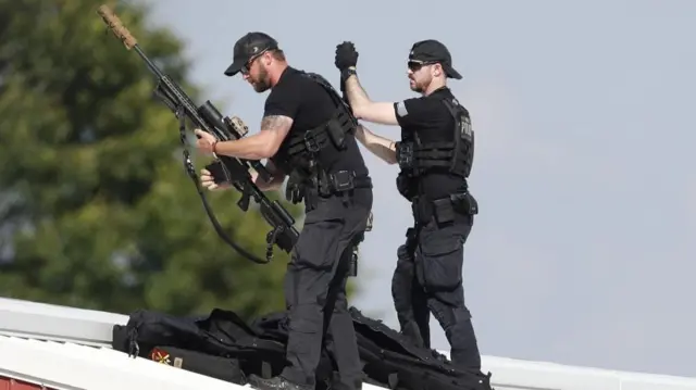 Law enforcement officers with guns