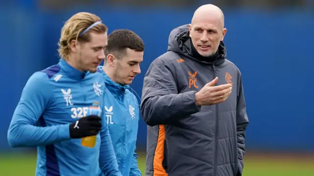 Rangers midfielder Todd Cantwell and manager Philippe Clement, either side of Tom Lawrence