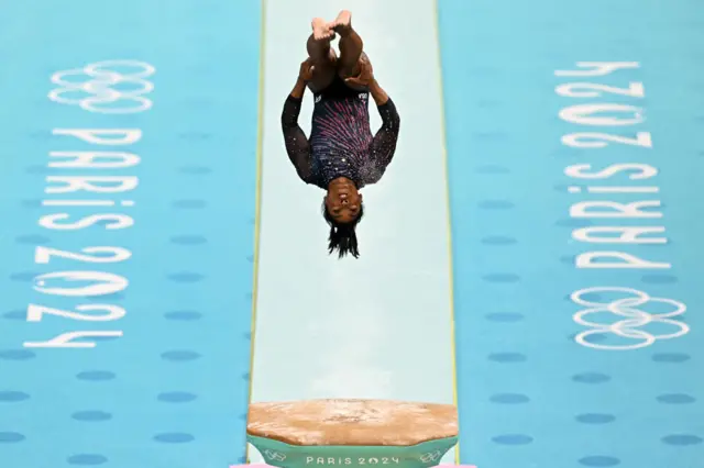 Simone Biles performs on the vault