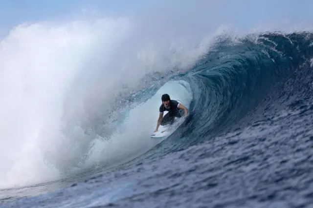 Molly Picklum surfing