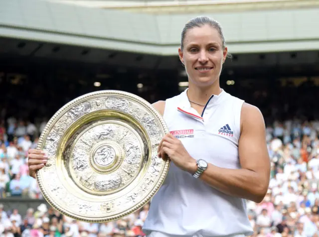 Angelique Kerber holds up the Venus Rosewater Dish