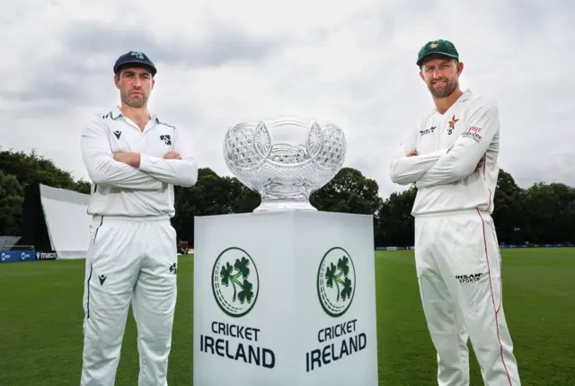 Captains Andrew Balbirnie and Craig Ervine with the match trophy at Stormont