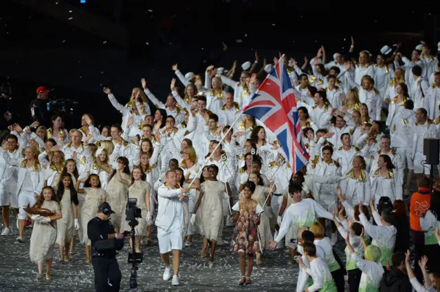 The Olympic team of Great Britain, led by flag bearer and cyclist Chris Hoy, marches into the Olympic Stadium during the Opening Ceremony for the London 2012 Summer Olympic Games