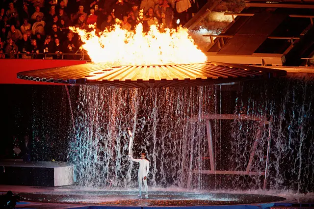 Cathy Freeman lighting the torch in Sydney