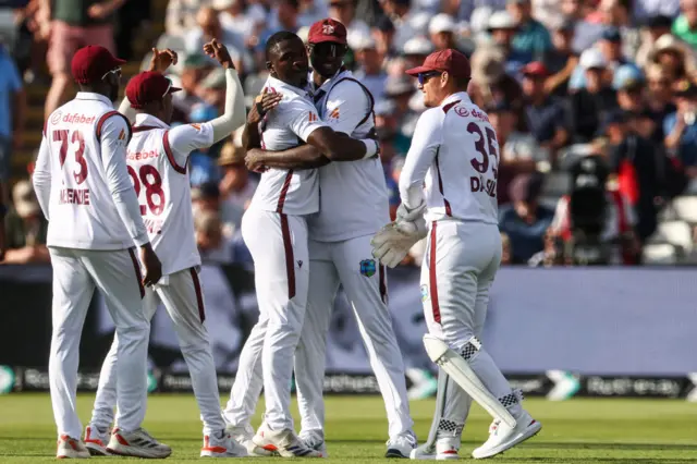 Jayden Seales and Jason Holder celebrate a wicket