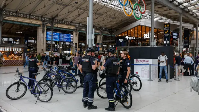 French police officers patrol inside Gare du Nord station in Paris, France