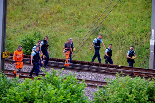 SNCF workers and police officers at the scene