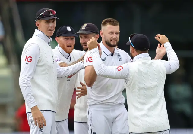 Gus Atkinson of England celebrates with team mates after taking the wicket of Mikyle Louis during day one of the 3rd Test Match between England and the West Indies at Edgbaston