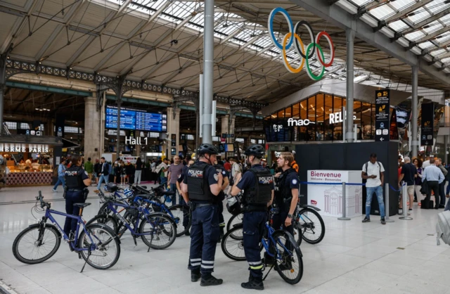 French police officers patrol inside Gare du Nord station in Paris