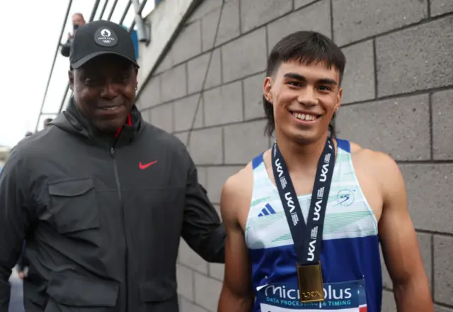 Gold medalist Louie Hinchliffe of Team City of Sheffield & Dearne AC (R) and his coach Carl Lewis,