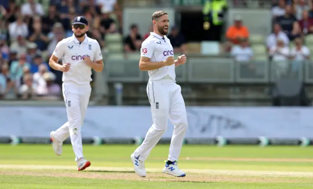 Chris Woakes celebrates a wicket