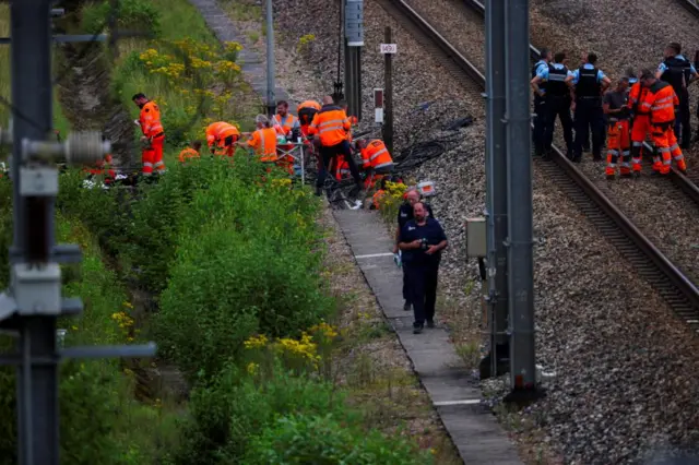 SNCF workers and police officers at the scene