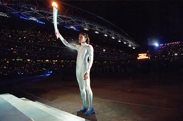 Cathy Freeman lighting the torch in Sydney