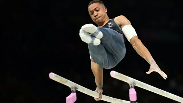 Joe Fraser on the parallel bars