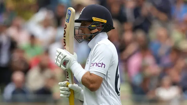 Joe Root reacts after being dismissed