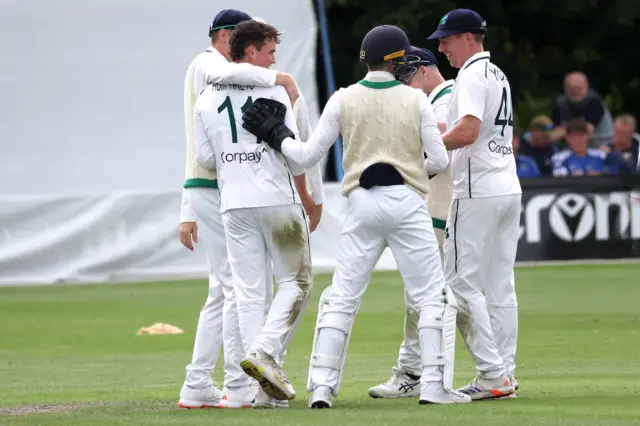 Matthew Humphreys celebrates his maiden Test wicket at Stormont