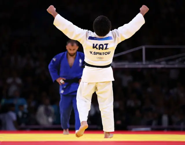 Yeldos Smetov celebrates winning gold in the Judo