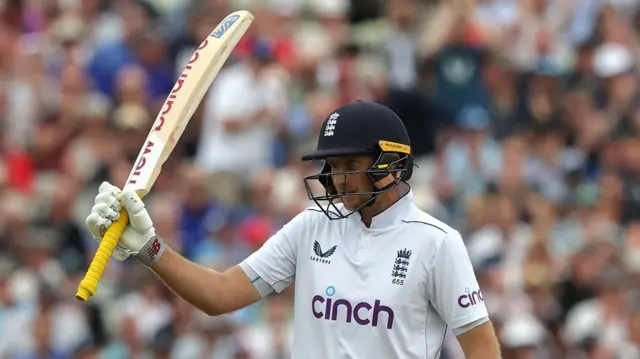 Joe Root celebrates his half-century