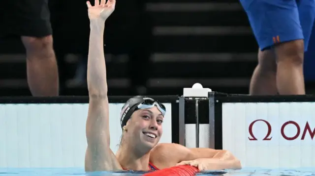 US' Gretchen Walsh reacts after setting an Olympic record in a semifinal of the women's 100m butterfly swimming event during the Paris 2024 Olympic Games at the Paris La Defense Arena in Nanterre, west of Paris