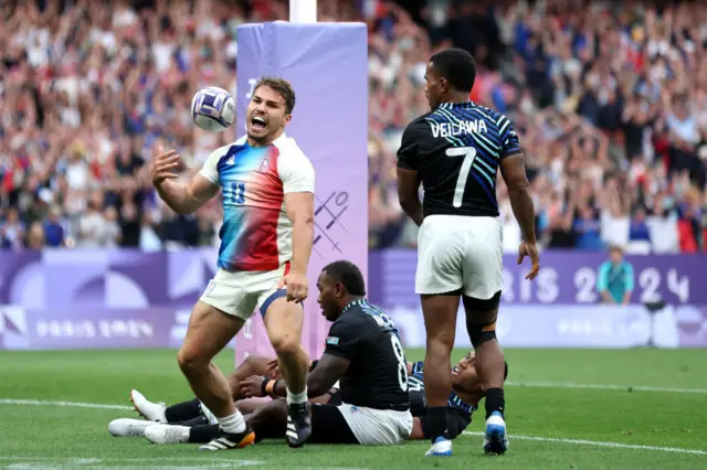 Dupont celebrates after scoring his try