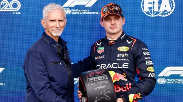 Max Verstappen poses with prize