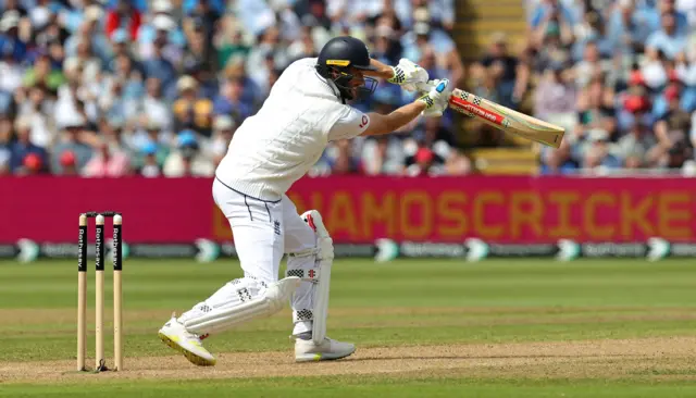 Chris Woakes drives for four