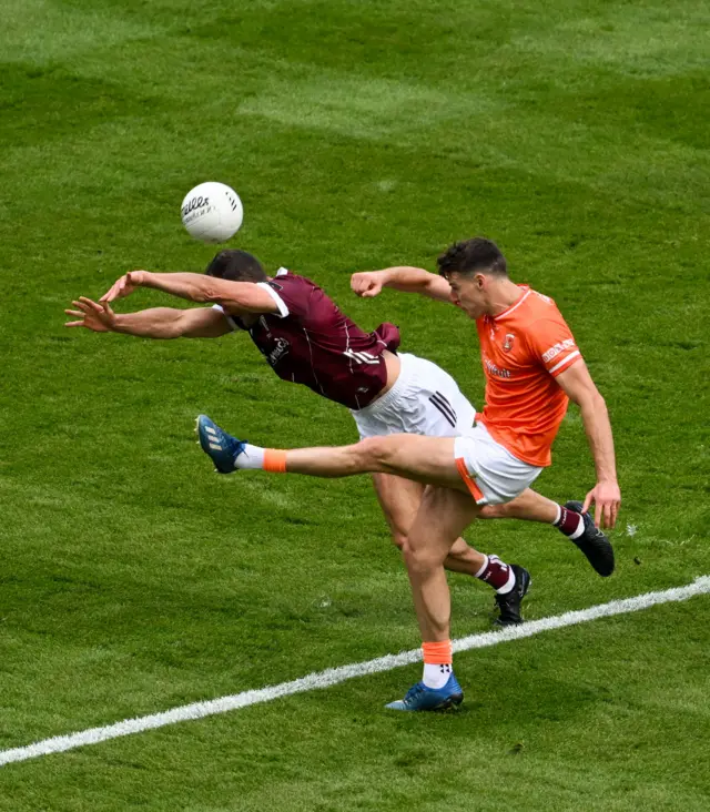 Niall Grimley of Armagh has his shot blocked by John Maher of Galway