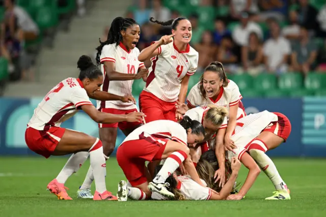 Vanessa Gilles #14 of Team Canada celebrates