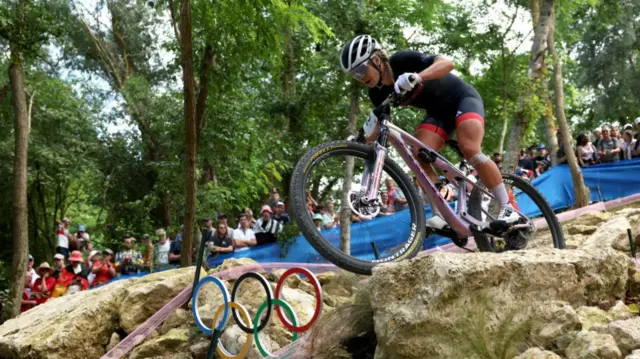 Evie Richards of Team Great Britain competes during the Women’s Cross-Country Cycling Mountain Bike Gold Medal race on day two of the Olympic Games Paris 2024 at Elancourt Hill