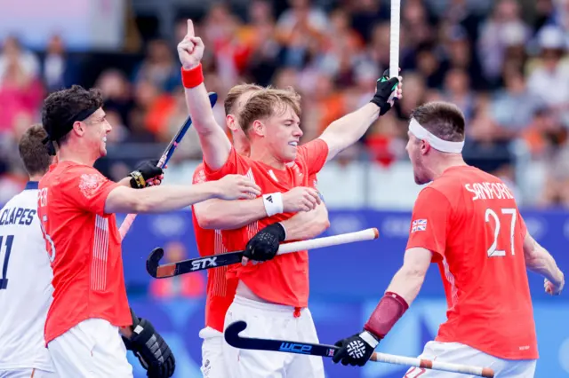 GB men's hockey team celebrating a goal against Spain in their Olympic opener