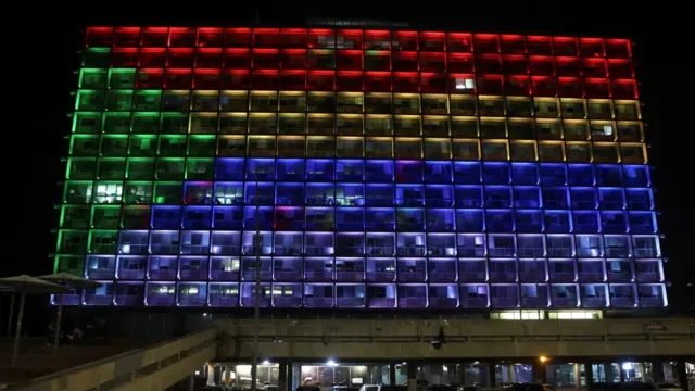 Tel Aviv city hall lit up with the Druze flag