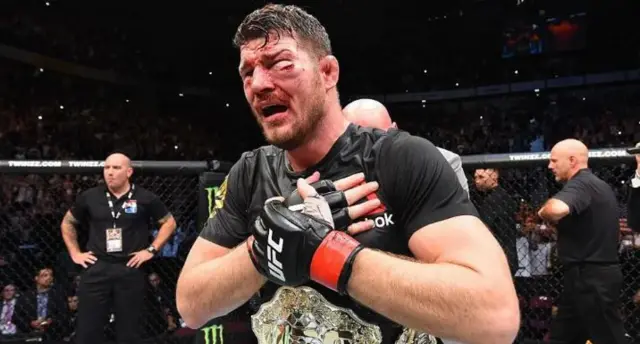 Michael Bisping holds his chest