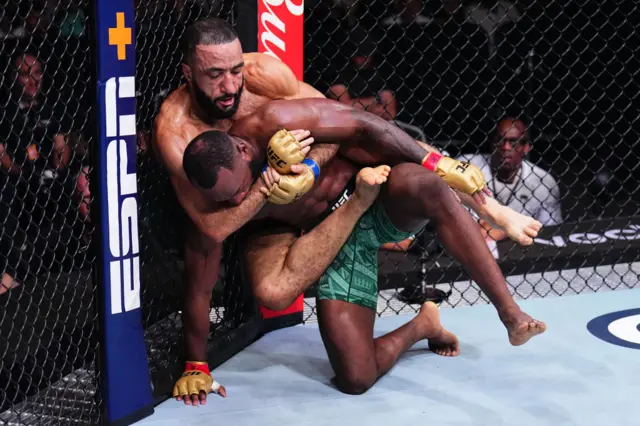 Belal Muhammad wrestles with Leon Edwards